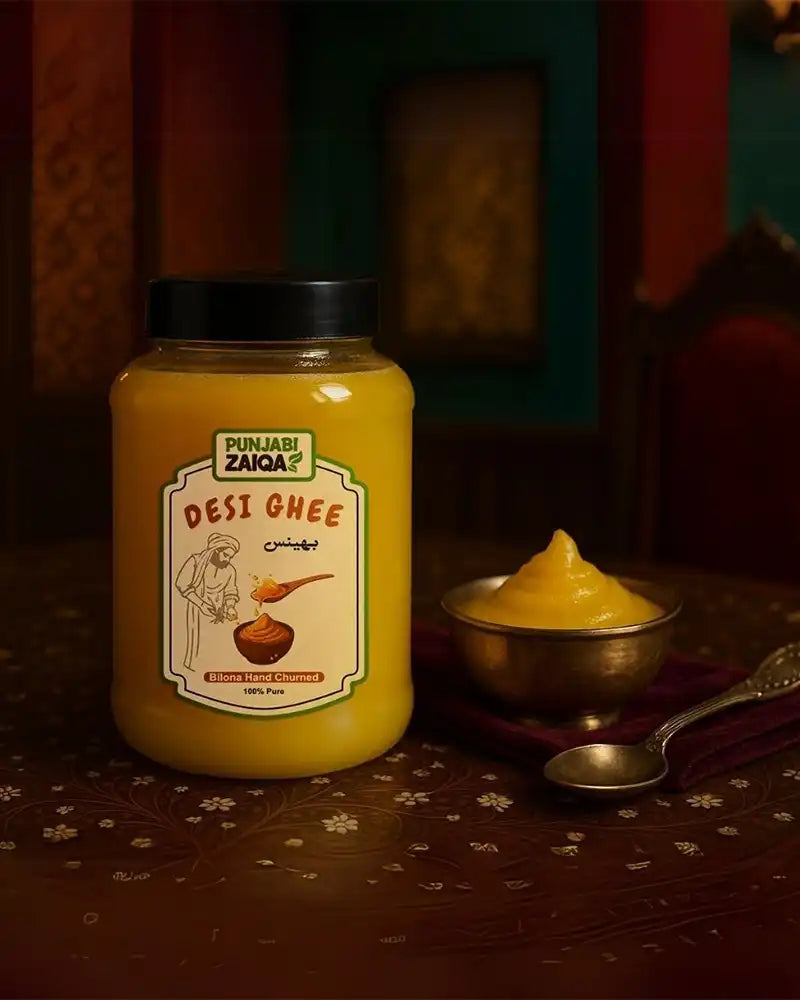 Jar of Desi Ghee with a spoonful on a patterned surface