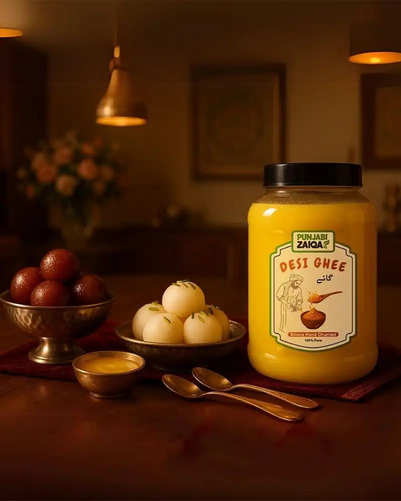 Jar of Desi Ghee on a table with fruits and utensils in a warm-lit room. Traditional Punjabi cow milk Ghee
